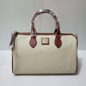 Dooney and Bourke pebble grain bone side pocket satchel.